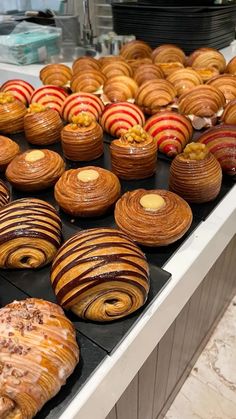 there are many different types of pastries on display