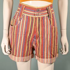 Super cute high waist shorts with a wide waistband, wide legs, and pockets. Multi-colored striped pattern - The colors are bright and clear.  Wide waist band - 2 3/4" with 2 metal buttons. Rolled cuffs on the leg. Belt loops. LABEL: Nada Nuff, Contempo Casuals. Made in Hong Kong.  SIZE: Marked 9  Refer to measurements for an accurate fit. All sizes are approximate. Waist: 27" Hip: 40 1/2" Length: 16" Inseam: 3" Rise: 11 1/2" Mannequin measurements:   Size 2, Bust 33"   Waist 24"   Hips 34" CONDITION: Excellent, pre-owned shorts.  COLOR: Multicolor- yellow, red, green, orange, purple + more. MATERIAL: Cotton, metal zipper. CARE: Machine wash OK.  Domestic Shipping: Priority Mail including tracking and insurance.   NO RETURNS: Vintage items are often fragile or one of a kind, our items are F