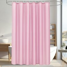 a pink shower curtain in a bathroom