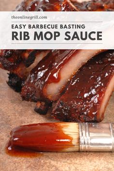 baked barbecue ribs with bbq sauce and a brush