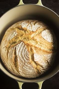 a loaf of bread sitting in a pan on top of a table