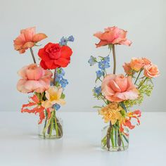 three vases filled with different types of flowers