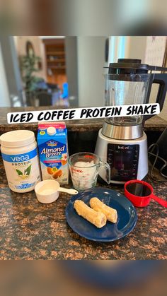 ingredients for iced coffee protein shake sitting on a kitchen counter with the words iced coffee protein shake above it