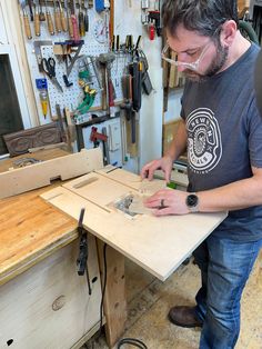 a man working on a piece of wood