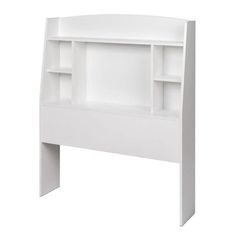 a white headboard with shelves for books