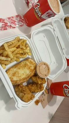 two takeout containers filled with chicken and fries