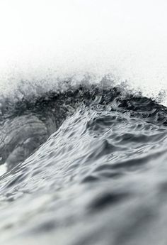 a person riding a wave on top of a surfboard