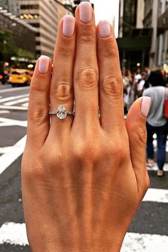 a woman's hand with a ring on it