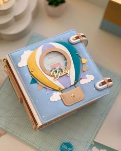 a blue and yellow purse sitting on top of a table