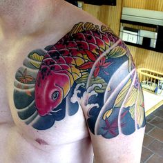 a man with a colorful tattoo on his chest