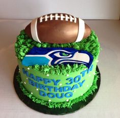 a birthday cake with a football on top