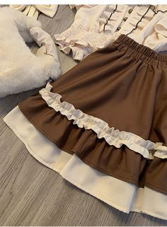 The price is for a skirt only, others are not included.   	 		 			Size 			S 			M 			L 			XL 		 		 			Waist 			62 			65 			68 			71 		 		 			Full Length 			38 			39 			40 			41 		 		 			Hem Circumference 			182 			186 			190 			194 Brown Ruffled Skirt For Spring, Spring Brown Skirt With Ruffles, Spring Brown Ruffled Skirt, Brown Ruffled Flared Skirt, Brown Ruffled Mini Skirt For Summer, Brown Ruffled Skirt For Summer, Brown Summer Skirt With Ruffles, Brown Ruffled Skirt, Brown Ruffled Mini Skirt