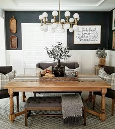 a dining room table with chairs and a bench