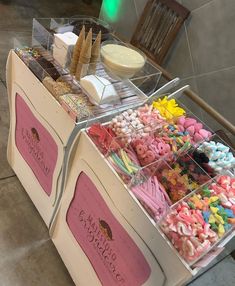 an ice cream stand filled with lots of different flavored treats