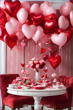 valentine's day table setting with red and pink balloons