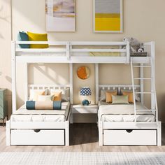 two white bunk beds sitting next to each other on top of a wooden floor in a room