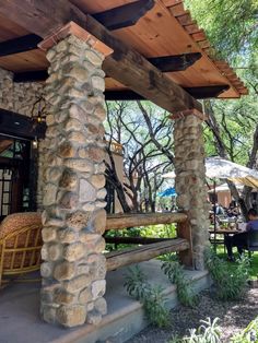 an outdoor seating area with chairs and umbrellas