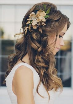 a woman with long hair and flowers in her hair