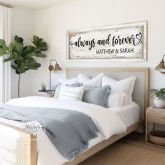 a bedroom with a bed, nightstands and potted plants