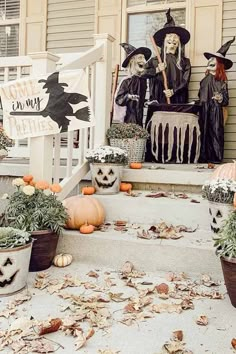 halloween decorations on the front steps of a house