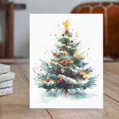 a card with a watercolor christmas tree on it