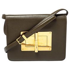 This Natalia bag from Tom Ford is here to end all your fashion woes, as it is striking in appeal and utterly high on style. It has been crafted from leather and designed with a flap that has a large turn lock carrying the signature TF engravings. The Alcantara insides are spacious and the bag is complete with a shoulder strap. This ultra-modern bag will lend you just the right amount of class and make you stand out like a true fashionista! Includes: Original Dustbag, Info Booklet Tom Ford Bag, Modern Bag, Ultra Modern, Green Leather, Tom Ford, Luxury Bags, Olive Green, Women Handbags, Bags Designer