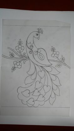 a drawing of a bird with flowers on it's tail and wings, sitting on top of a piece of paper