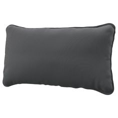 a dark gray pillow on a white background