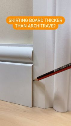 a pencil sticking out of the side of a white wall next to a box with writing on it that says, skitting board thicker than archtrave?