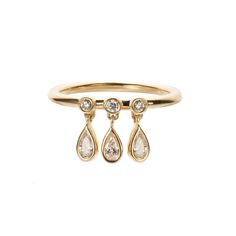 Obsessed with the dangles! A playful take on a classic wedding band, Nora takes it to a whole new level with three pear-cut diamond drops that move and sparkle as you move and sparkle 14k yellow gold pear-cut diamond drops all diamonds are conflict-free band measures 1.5mm wide, diamond drops are 6mm tall This piece is Dangle Ring, All That Glitters Is Gold, Classic Wedding Band, Pear Cut Diamond, Diamond Drops, Classic Wedding, Earring Necklace, Ring Necklace, Wedding Band