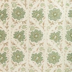 an old wallpaper pattern with green and brown flowers on white background, closeup