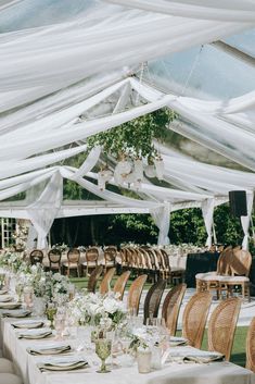 tables and chairs are set up under the tent