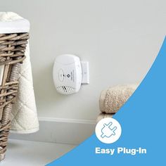 a wicker basket next to a white wall with an easy plug in on it