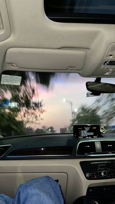 the inside of a car with dashboard lights and electronic devices on it's dash board