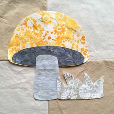 the paper is cut out and placed on top of each other to make an origami hat