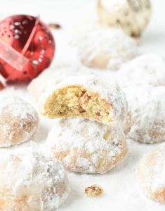 powdered sugar covered doughnuts with a bite taken out