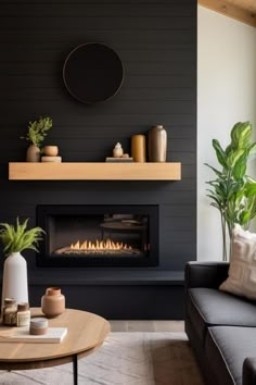 a living room with a couch, coffee table and fire place in front of the fireplace