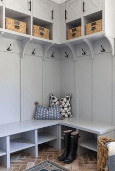 a white bench with some baskets on it