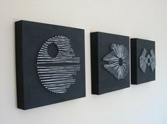 three black and white artwork hanging on the wall