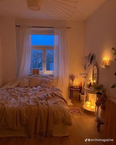 a bed room with a neatly made bed and candles on the windows sill next to it