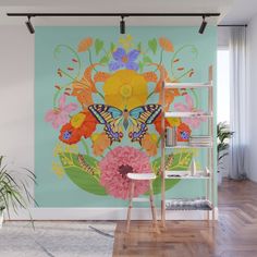 a wall mural with flowers and a butterfly on it in a living room area next to a ladder