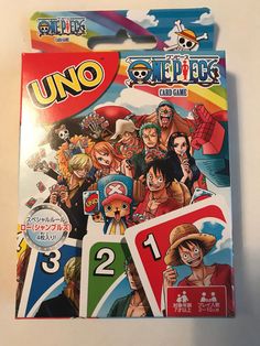 an unopened card game with the characters from one piece and two different games