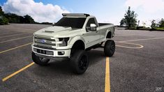 a white truck parked in a parking lot