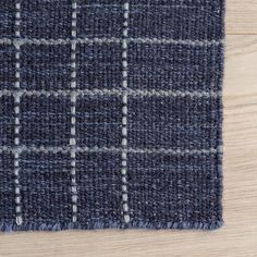 a close up view of a blue and white checkered rug