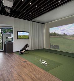 a golf simulator is set up in a large room