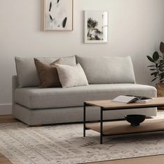 a living room scene with focus on the couch and coffee table