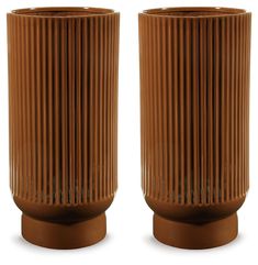 two brown vases sitting side by side on top of each other in front of a white background