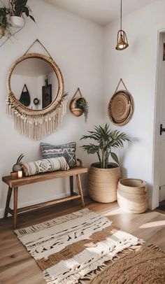 a living room with some plants and rugs on the floor