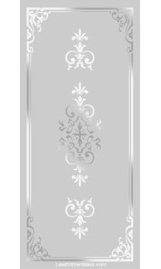 the back side of a clear plastic door with an ornate design on it and white trimming