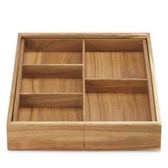 an empty wooden tray with compartments on it